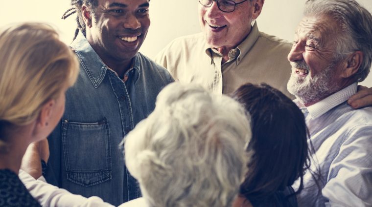 Group of diverse people gathering together support teamwork